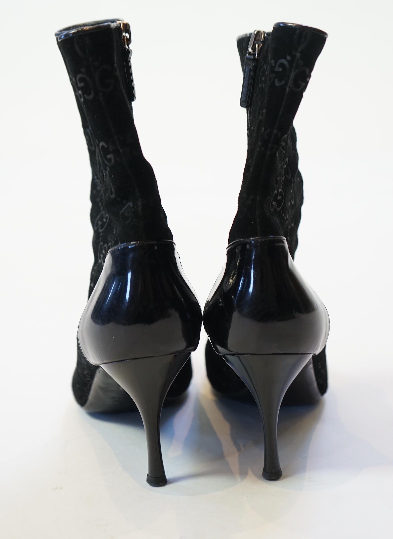 A pair of Gucci monogram pattern and ribbon black lady's suede ankle boots, size EU 38.5